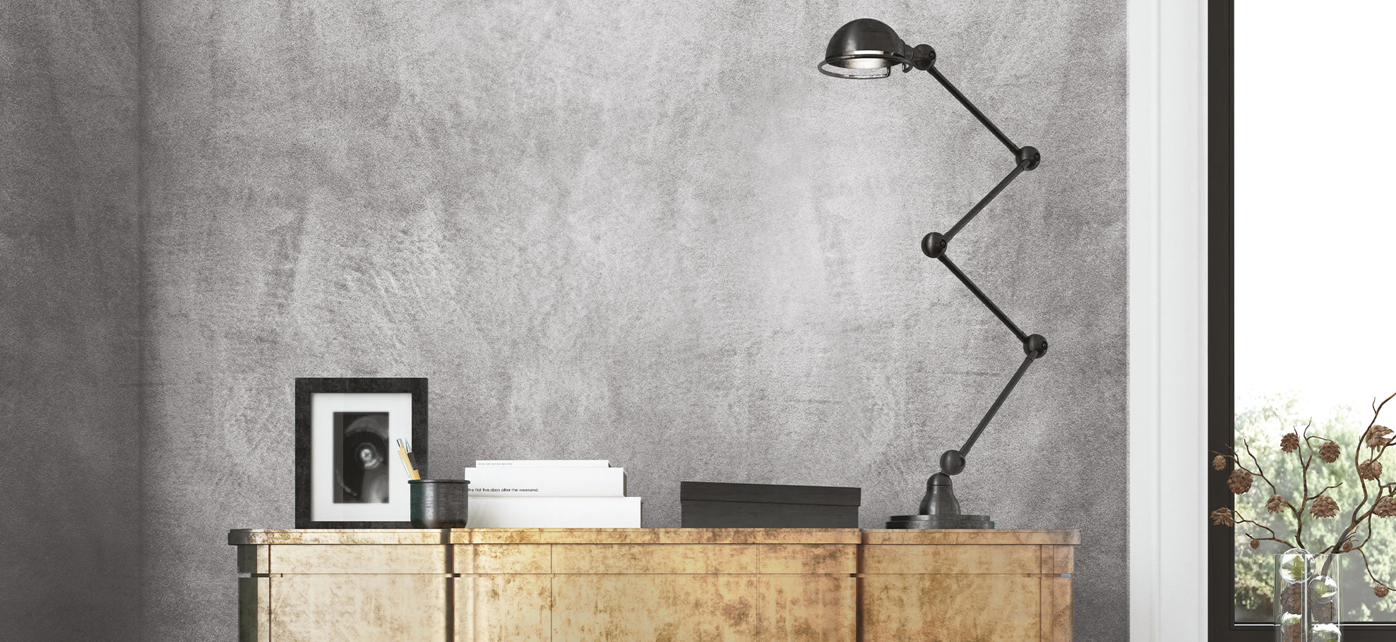 Stylish workspace featuring MONOLITH - NEUTRO GRANA MEDIA NEW 20kg wall finish and modern desk lamp.